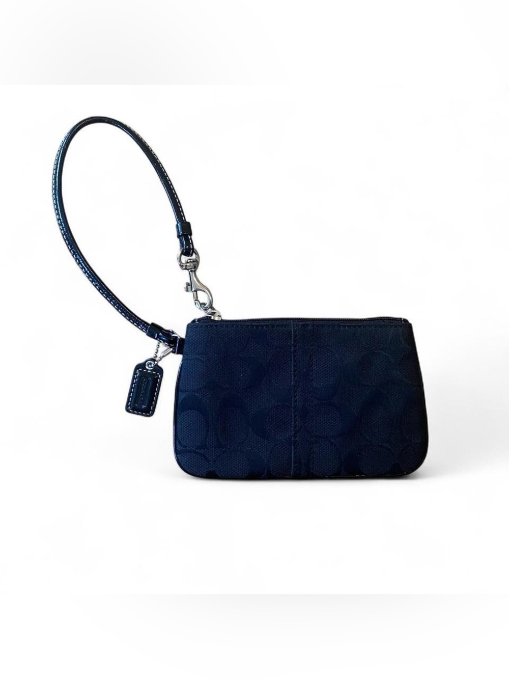 Black Coach wristlet with signature canvas jacquard print